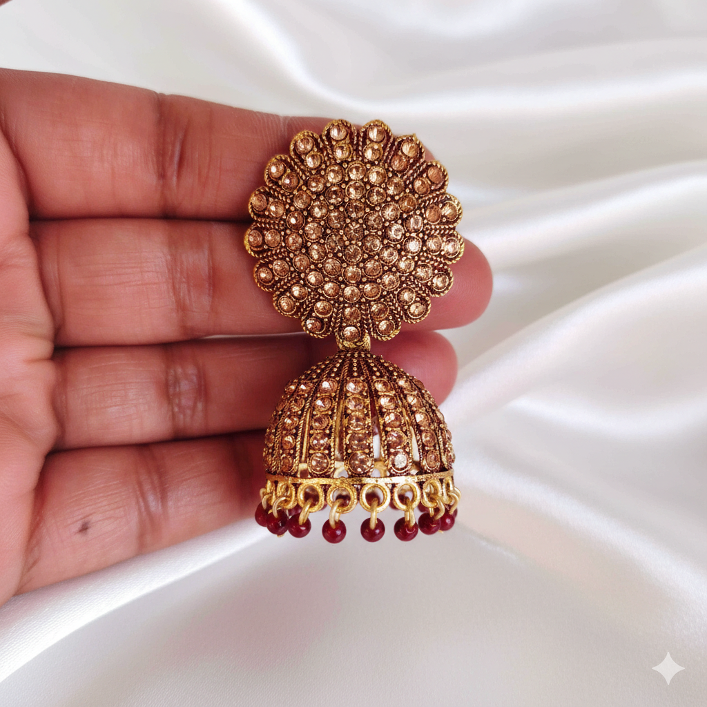 Royal Gold Stone Studded Jhumka Earrings with Maroon Bead Drops